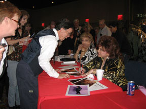 Connie signing autographs